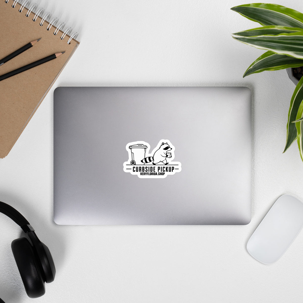 Curbside Pickup Florida raccoon sticker on laptop